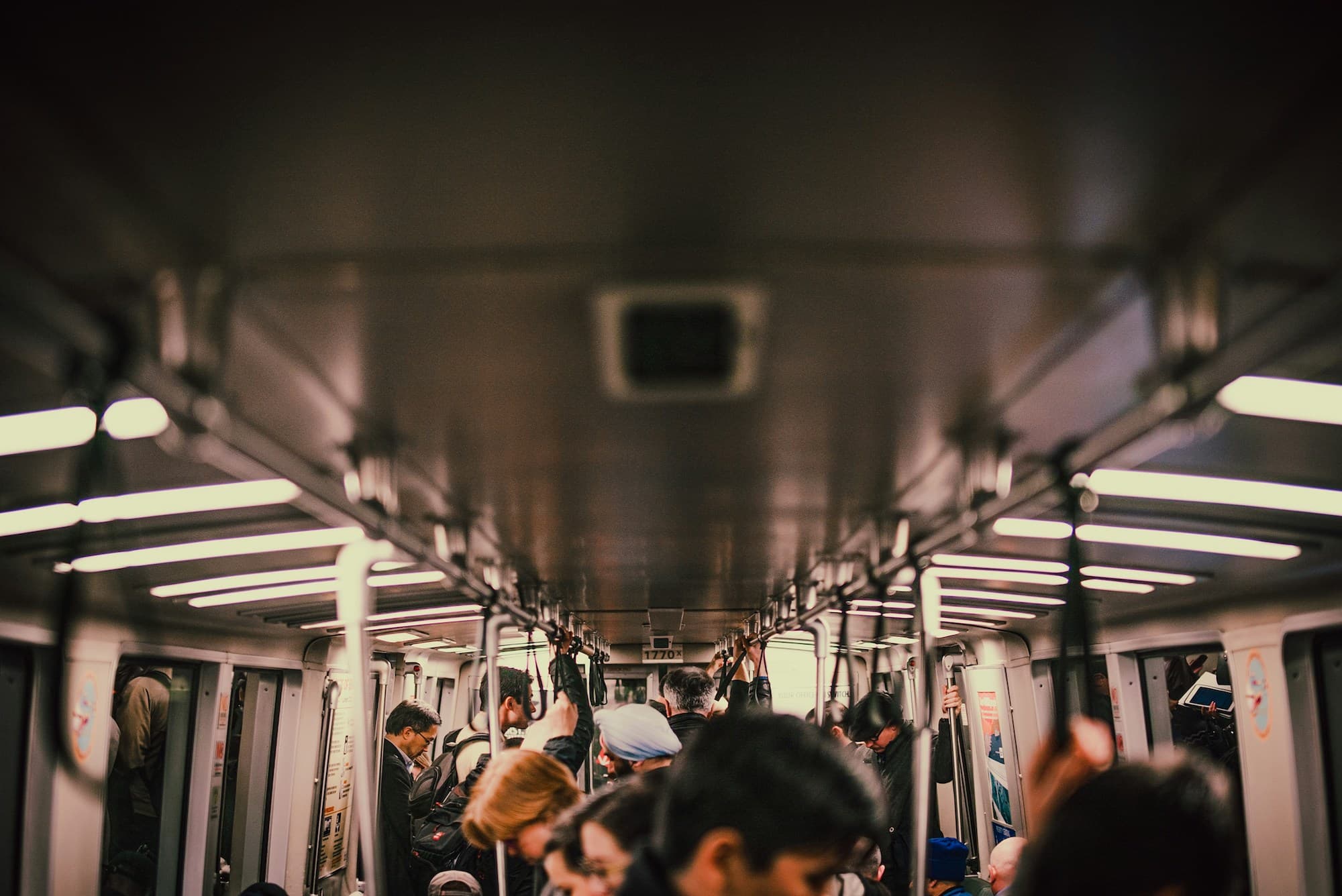 image of riders on public transit